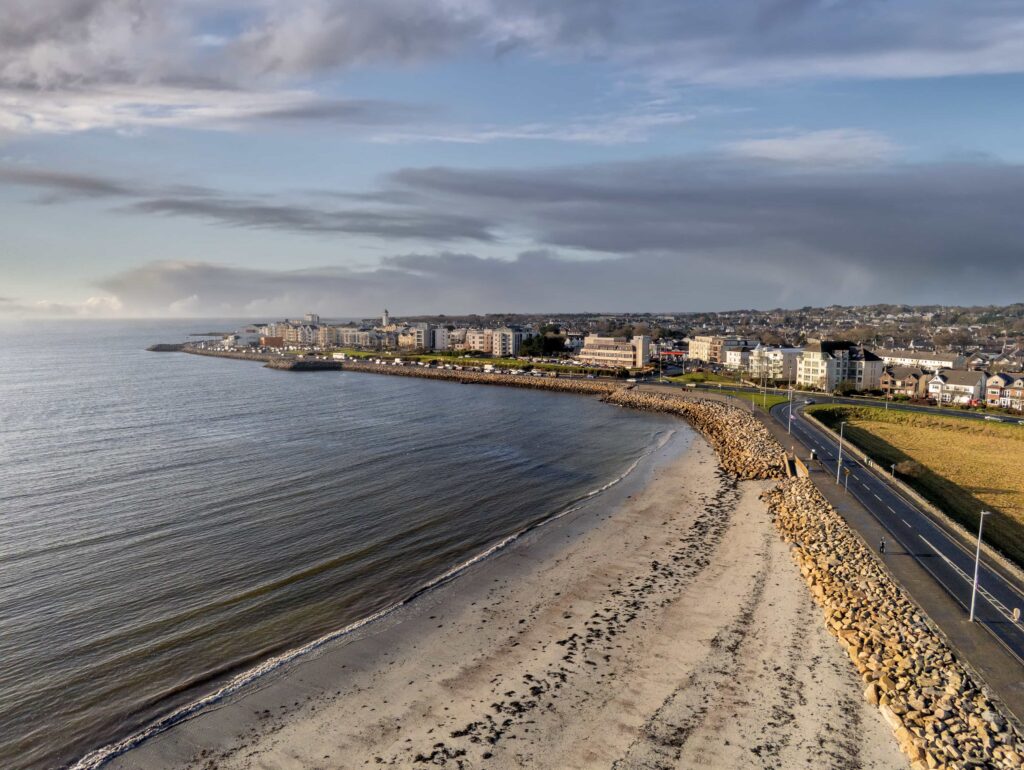 Grattan beach, Salthill promenade, Galway city, Ireland, Aerial view, Calm sky and waves of Atlantic ocean